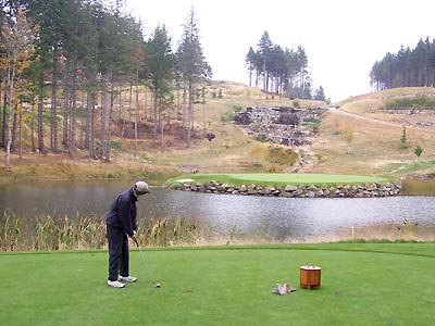 Sharon playing the par 3 island green at Bear Mountain