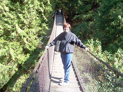 Sharon on a rope suspension bridge near Donna's place