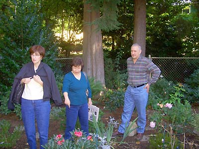 Sharon, Donna and John in their garden