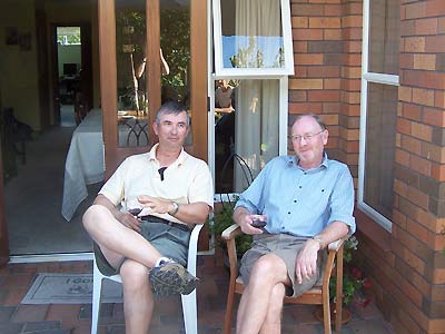 Ray and friend having a glass of wine in his backyard