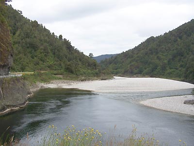 Road weaves along the river just right of truck picture