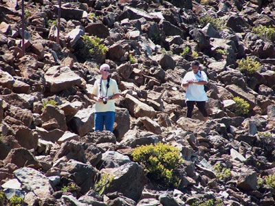 John wandering in the rubble looking for a good snap